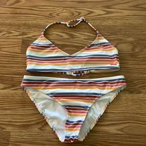 roxy bikini. bottoms have full coverage. no padding in the bra.